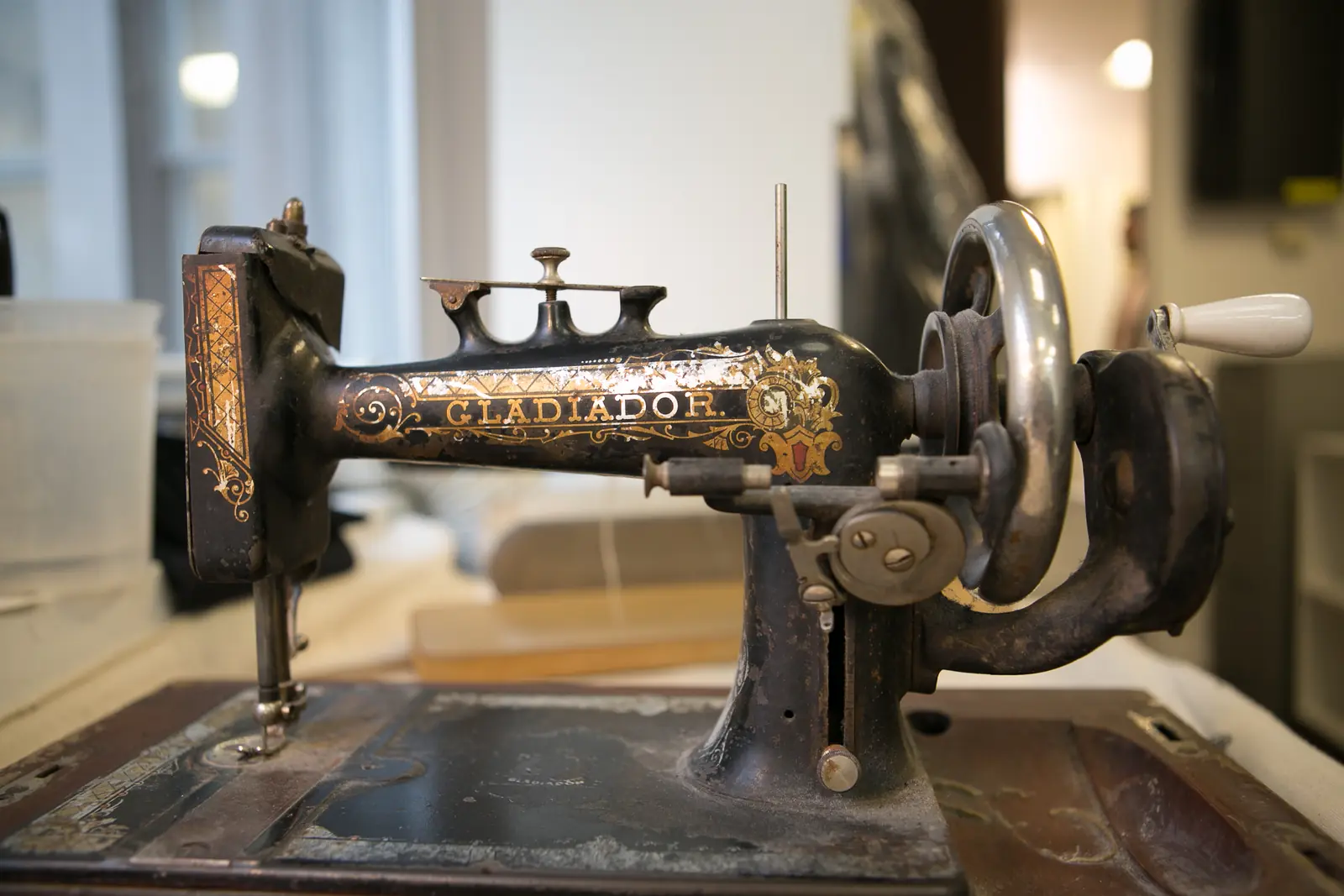 Vintage sewing machine and tailor tools on a workbench