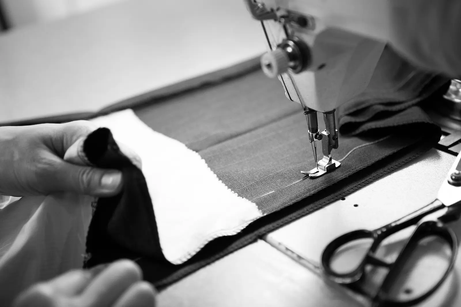 Close-up of hand stitching on a custom garment